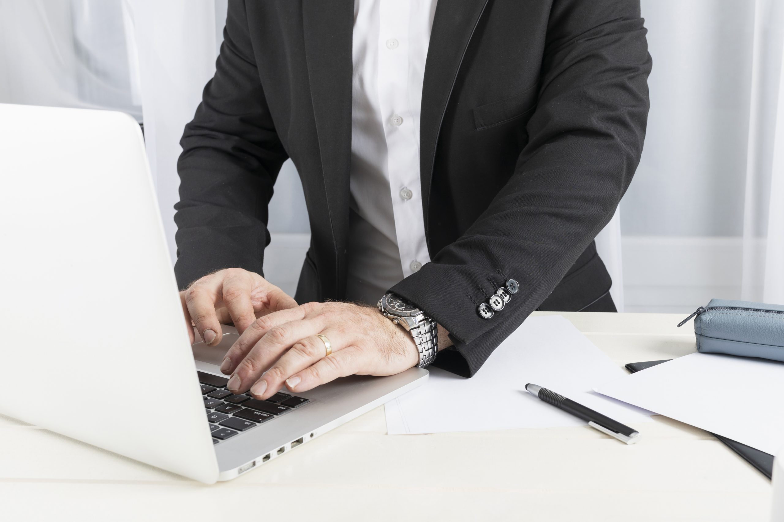 front-view-business-man-working-his-laptop